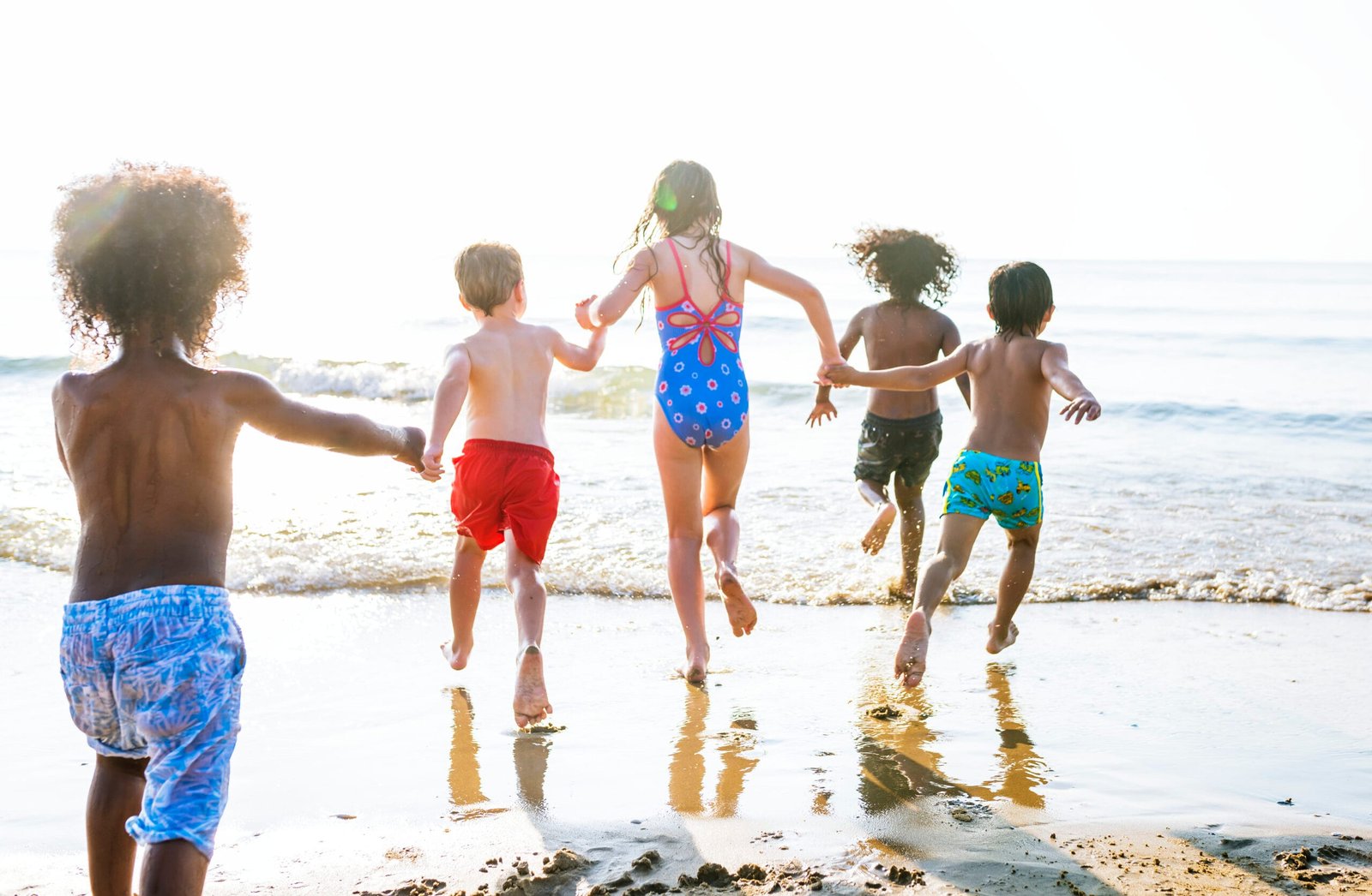 Kids running at the beach