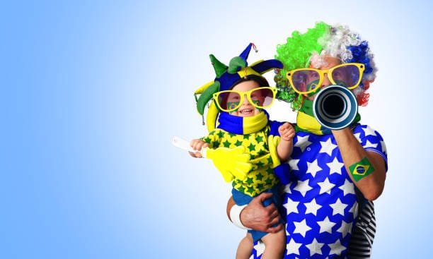 Father in a wig and the son of the Brazil fans