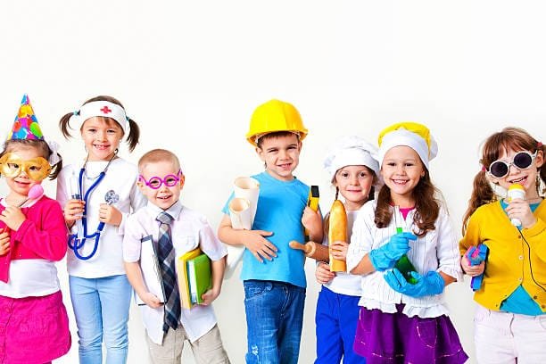 Group of seven children dressing up as professions